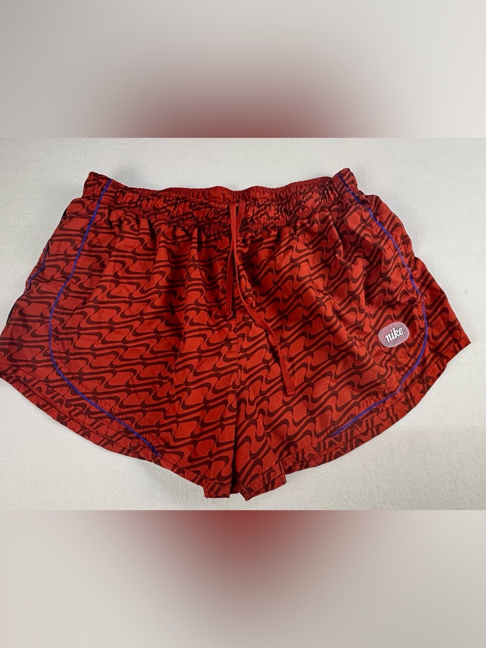 Nike Red Patterned Athletic Shorts with Black Wave Print